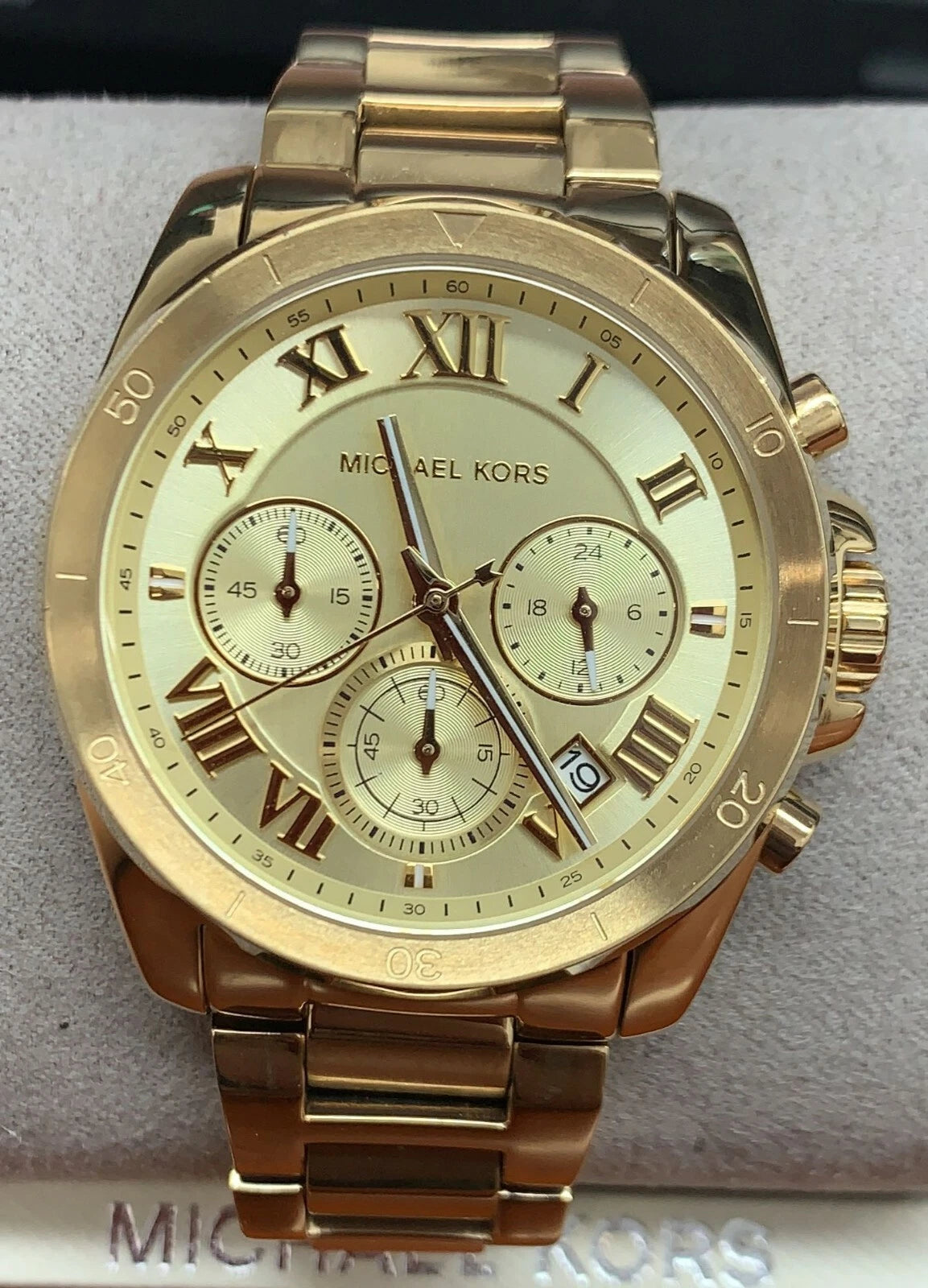 Side profile of Michael Kors Brecken MK6366 gold stainless steel chronograph watch