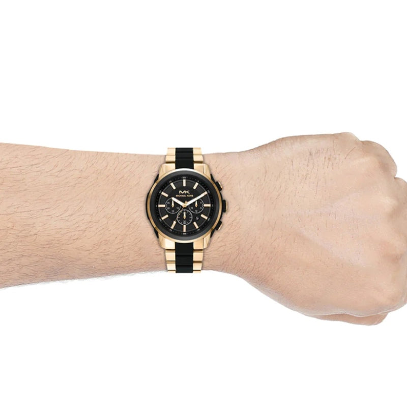 Close-up of Michael Kors MK8990 crystal embellished gold chronograph dial