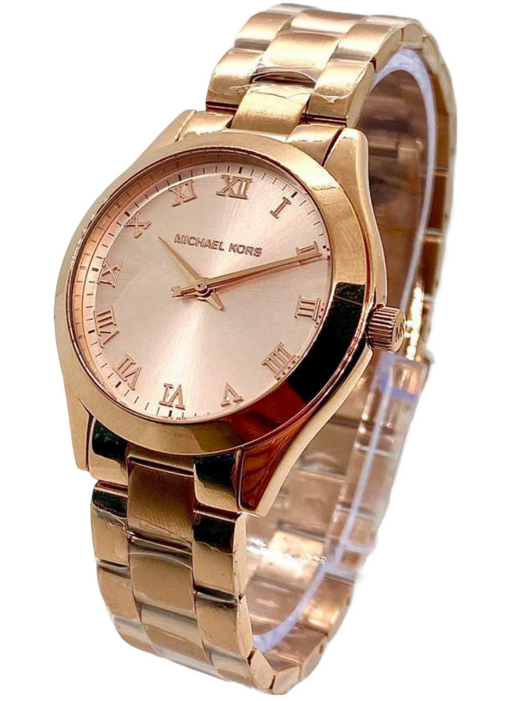 Close-up view of Michael Kors MK3457 rose gold analog dial with index hour markers