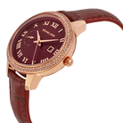 Side profile of Michael Kors Whitley MK2430 rose gold-tone case and burgundy leather strap