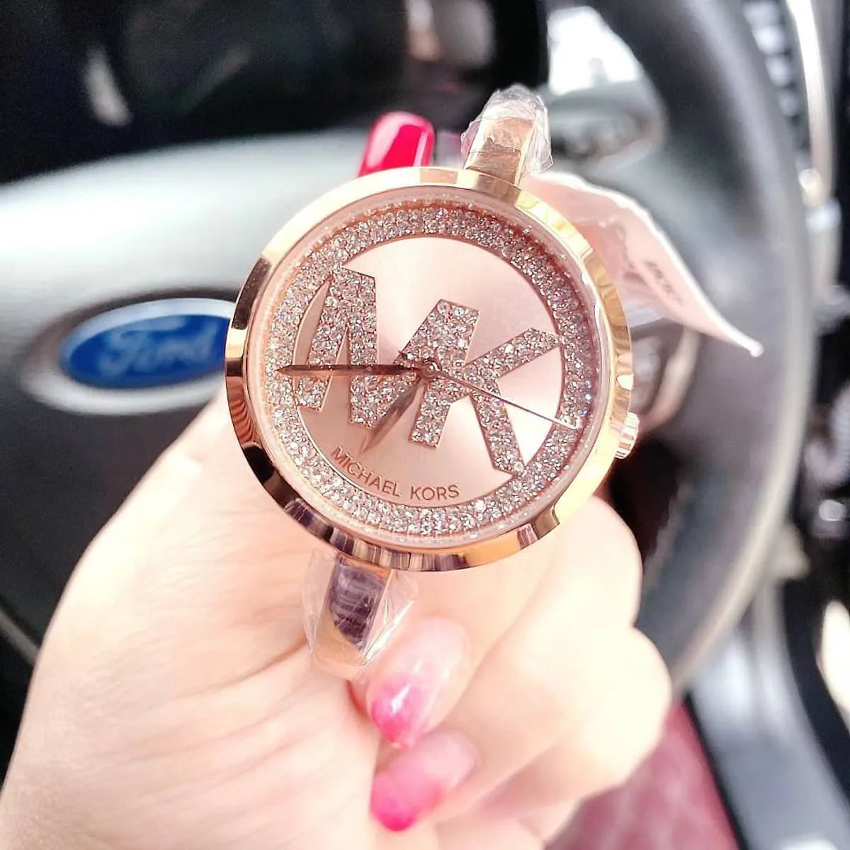Close-up view of Michael Kors MK3631 rose gold analog dial with elegant markers