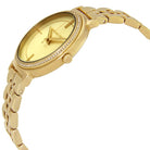Close-up view of Michael Kors MK3681 gold analog dial with elegant hour markers