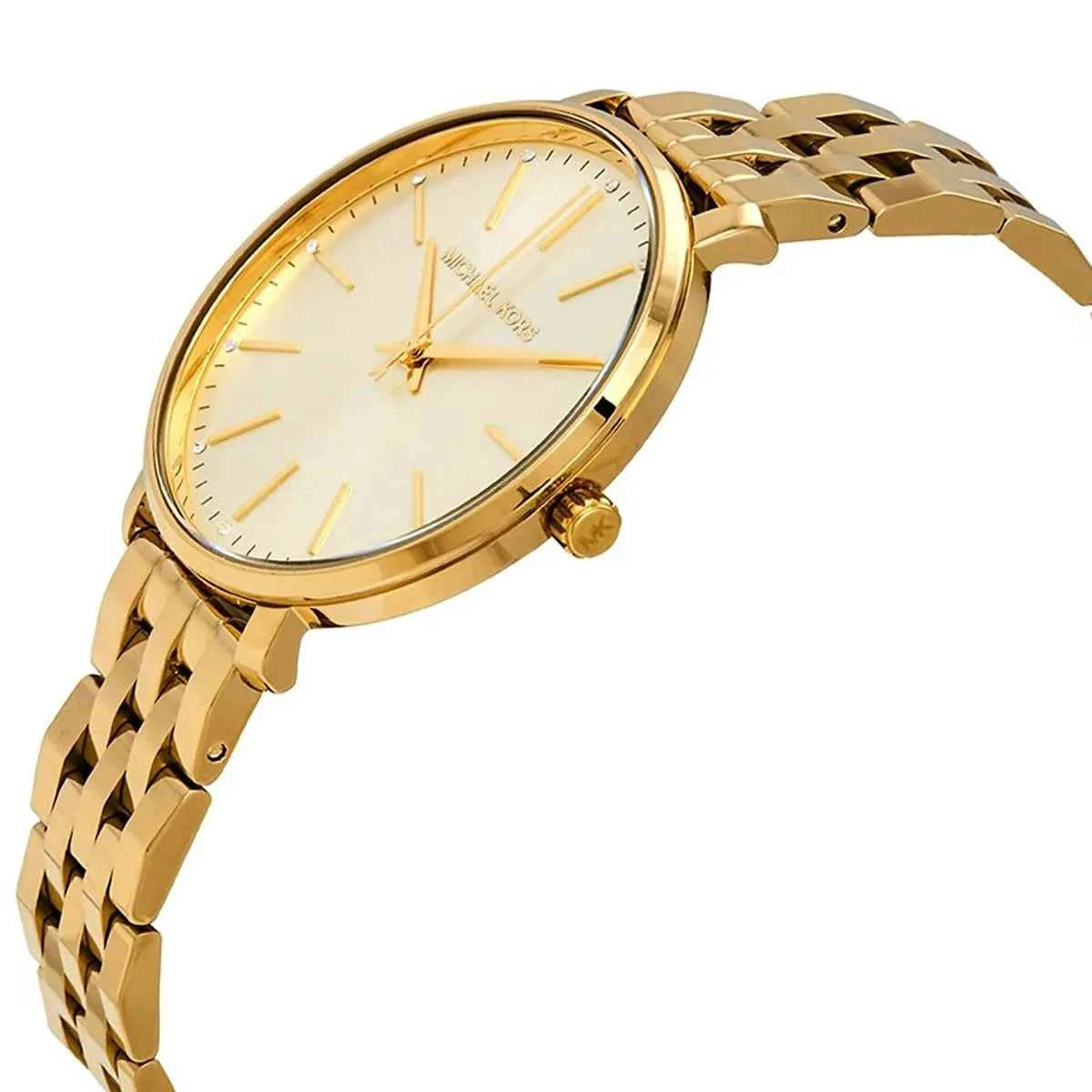 Close-up view of Michael Kors MK3898 gold analog dial with elegant hour markers
