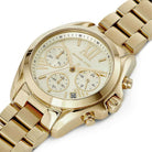 Side profile of Michael Kors Mini Bradshaw MK5798 gold stainless steel bracelet watch